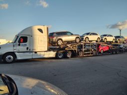 2012 FREIGHTLINER CASCADIA & 7 CAR HAULER